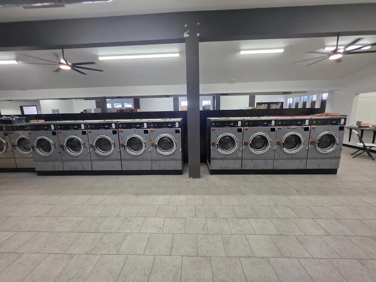 Finished laundromat with installed rows of washers