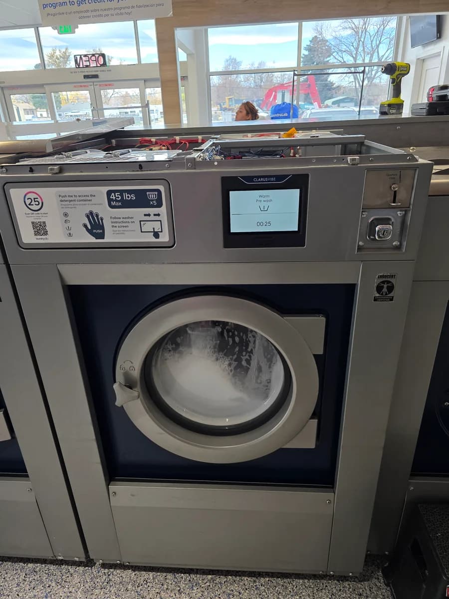 Electrolux Professional commercial washer with its top panel open for service